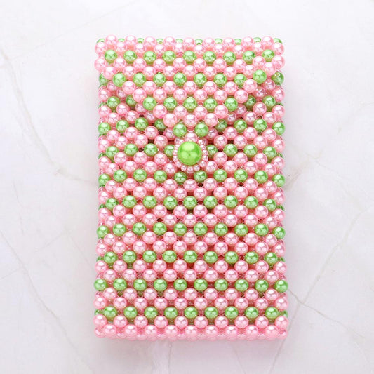 Pink and green beaded phone holder crossbody bag with a clasp closure and shoulder strap.