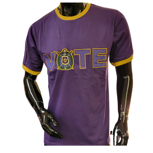 Omega Psi Phi fraternity member wearing a purple t-shirt with "VOTE" and the fraternity's crest.
