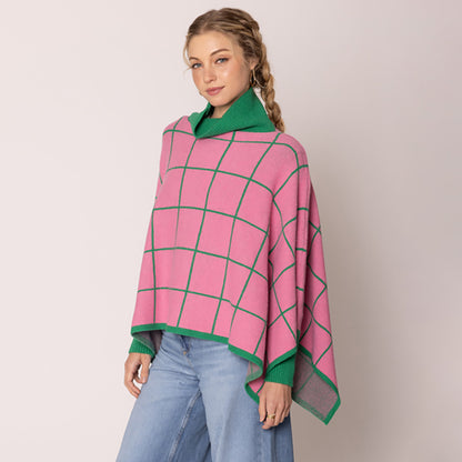 "A pink and green striped poncho with a turtleneck and asymmetrical hem."