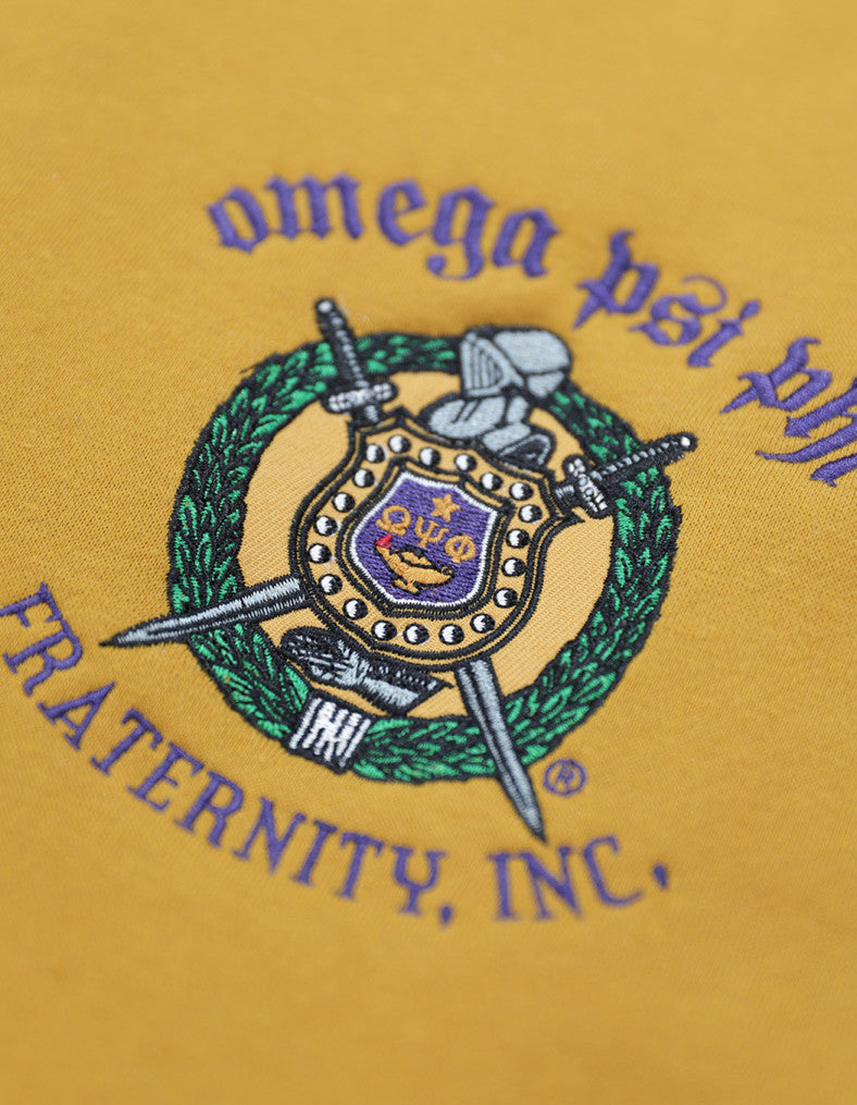 Omega Psi Phi Fleece Jacket close-up of Fraternity Crest Shield